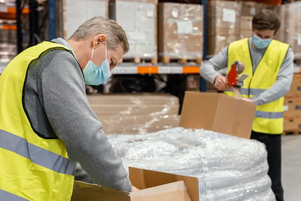 Men in warehouse working